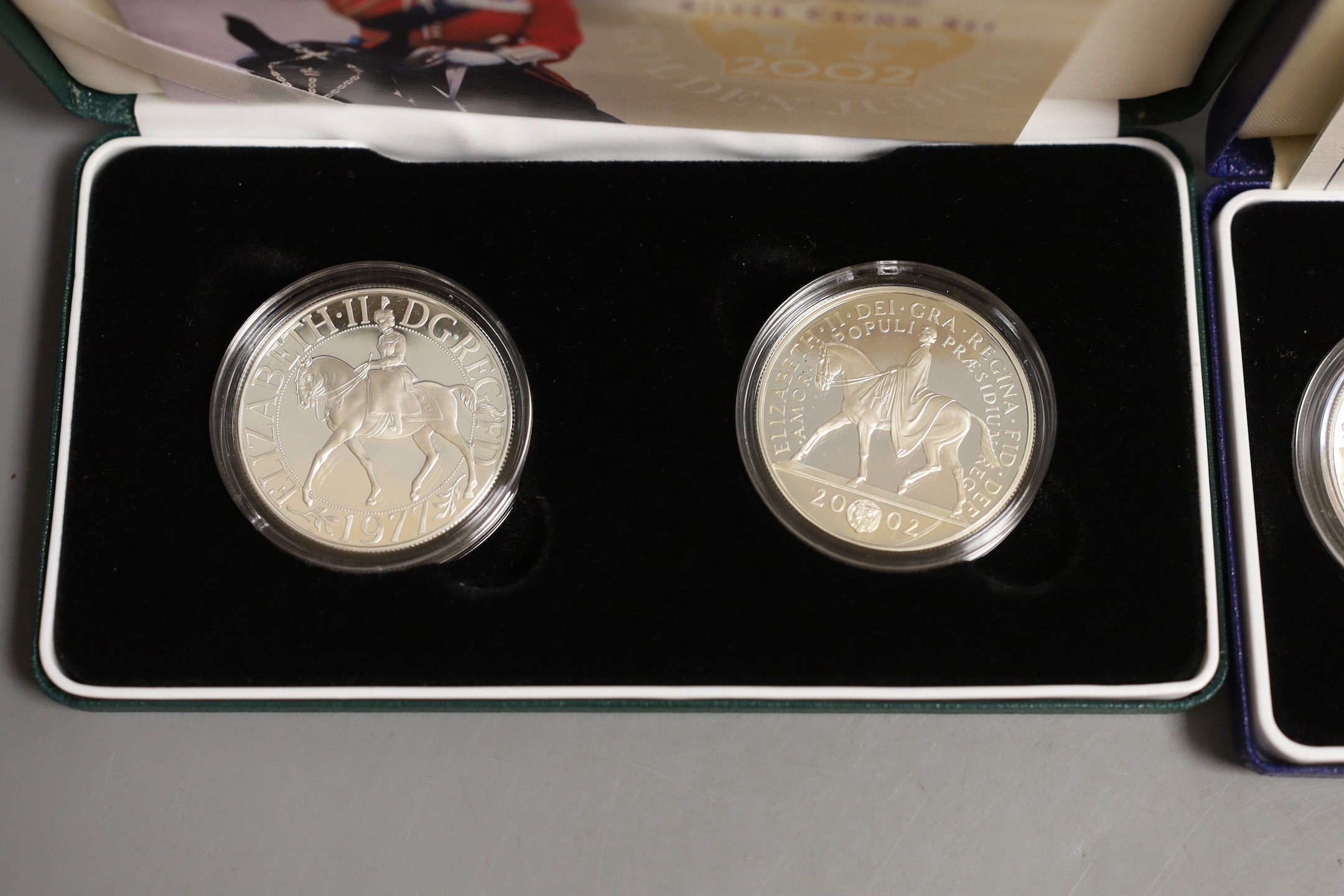 Cased Royal Mint UK silver proof coins – 2006 Victoria Cross two 50 pence, HM Queen silver jubilee two crown set and a 1994 three coin collection commemorating the 50th anniversary of the allied invasion of Europe (3 set